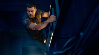 Man climbing stairs dark room - a flashlight free wallpaper