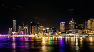 City skyline bridge river night 70 - the water and a bridge in the foreground free wallpaper