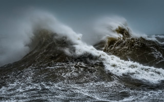 Large wave crash ocean boat - a boat in the foreground free wallpaper for desktop