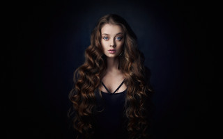 Woman curly long hair blue - a picture in the dark free wallpaper