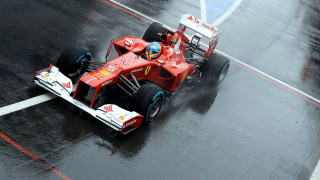 Red racecar wet track rain - a red race car free wallpaper for desktop