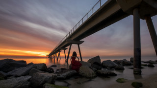 Woman rocks bridge sunset ocean - arthur b. carles free wallpaper