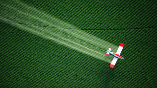 Plane green field smoke environmental - over a green field free wallpaper
