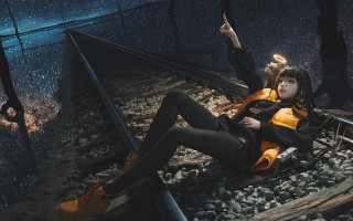 Woman sitting traintrack photorealism night - a train track in the background free wallpaper