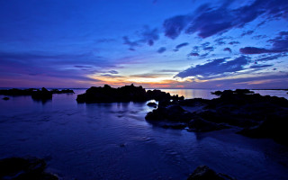 Sunset water rocks clouds beach - the foreground and a sky free wallpaper for desktop