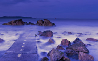 Pier rocky beach ocean night - a rocky beach next free wallpaper