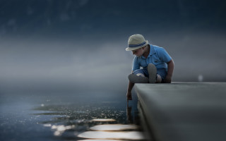 Man sitting ledge hat reflective - reflective free wallpaper