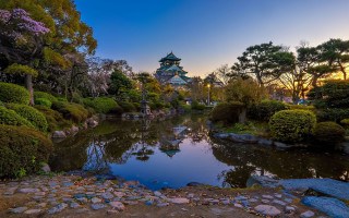 Pond park sunset trees rocks - a pagoda in the background free wallpaper