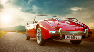 Red sports car cloudy sky 13 - a road under a cloudy sky free wallpaper for desktop