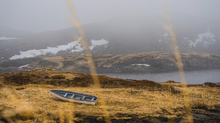 Boat grassy mountains snowy water - the top of it free wallpaper