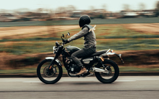 Motorcycle rider tiltshift motionblur field - a person riding free wallpaper