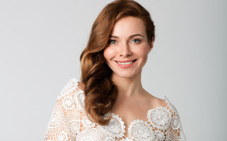 Smiling woman white lace top - head and shoulders portrait free wallpaper for desktop