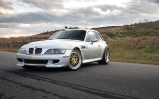 White car hillside 3d render - the side of a road next free wallpaper