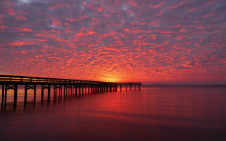 Long pier sunset red sky - free sunset wallpaper