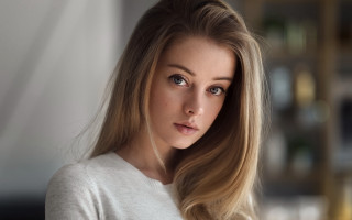 Blonde woman serious portrait bokeh 2 - her face and shoulders free wallpaper