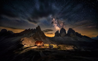 Mountain cabin night sky stars - a mountain range in the background free wallpaper