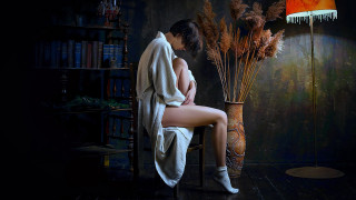 Woman sitting lamp flowers towel - a chair next free wallpaper