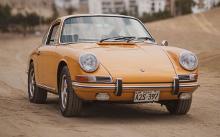 Yellow porsche dirt road building - a dirt road in front free wallpaper