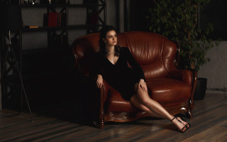 Woman black dress brown chair - a brown chair free wallpaper