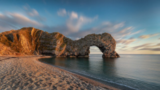 Rock formation beach sky water - a sandy shore free wallpaper