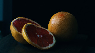 Grapefruits halved stilllife darkbackground neo - a table top free wallpaper