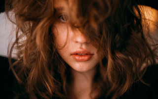 Concerned woman long hair portrait - her face and shoulders free wallpaper