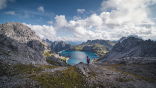 Mountain top lake cloudy sky - a lake and mountains free wallpaper