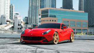 Red sports car cityscape bridge - a city skyline free wallpaper