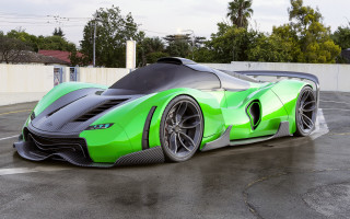 Green black sports car parking - a white fence free wallpaper for desktop