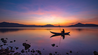 Sunset mountain lake boat man - arthur quartley free wallpaper