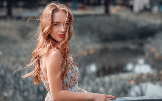 Woman leaning pond blurry bokeh - a dress free wallpaper