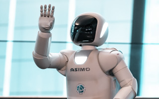 Robot waving building blurry helmet - les automatiste free wallpaper