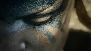 Close up painted face eye - a close up of a person free wallpaper