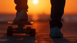 Skateboarder sunset desert cinematic fire - a person riding free wallpaper