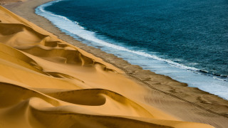 Beach wave sand dunes ocean - a microscopic photo free wallpaper