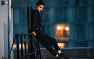 Woman leaning railing black pants - black pants free wallpaper