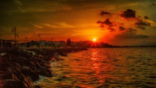 Sunset cityscape clouds water reflection - bascove free wallpaper for desktop