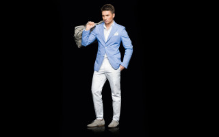 Man bluejacket whitepants holdingjacket camera - white pants free wallpaper