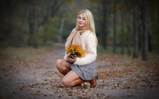 Woman kneeling flowers forest portrait - a forest area free wallpaper