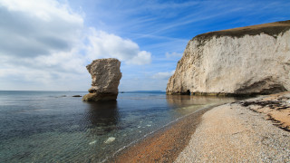 Rock water beach formation mountain - a rock formation free wallpaper