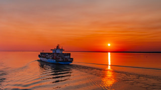 Boat sunset dawn water fire - the distance behind free wallpaper