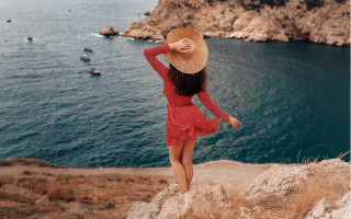 Woman red dress hat cliff 2 - a red dress and hat free wallpaper