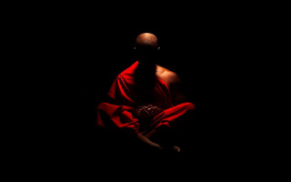 Red robe man sitting dark - a red robe free wallpaper