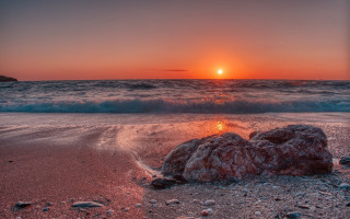 Sunset ocean rock wave island - a small island in the distance free wallpaper