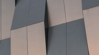 Clock building deconstructivism abstract sculpture - the side of a building free wallpaper