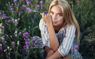 Woman flower field serious portrait 3 - her chin free wallpaper