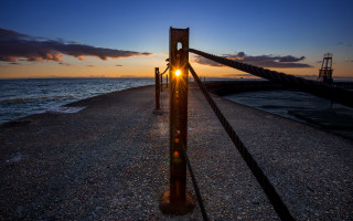 Sunset pier light fence clouds - in the foreground free wallpaper for desktop