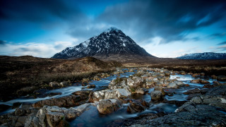 Mountain stream rocks cloudy sky - photography free wallpaper