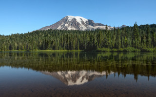 Mountain reflection lake forest blue - a clear blue sky in the background free wallpaper