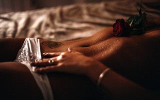 Woman rose tattoo blurry closeup 2 - her arm and chest free wallpaper